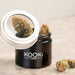 Small black glass jar with 5x magnifying lid for weed storage
